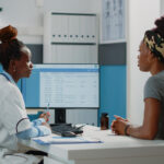 A female doctor explaining medical terms she found on her female patient full medical check-up